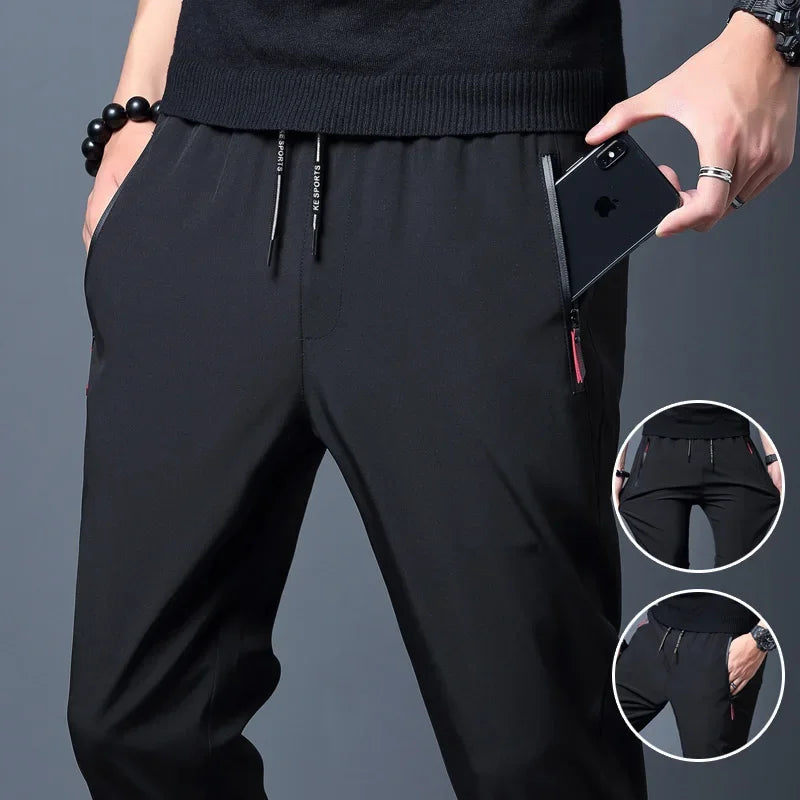 Calça casual masculina elástica, slim fit, cintura elástica, jogger, estilo coreano, clássica, azul, preta e cinza, tamanhos grandes