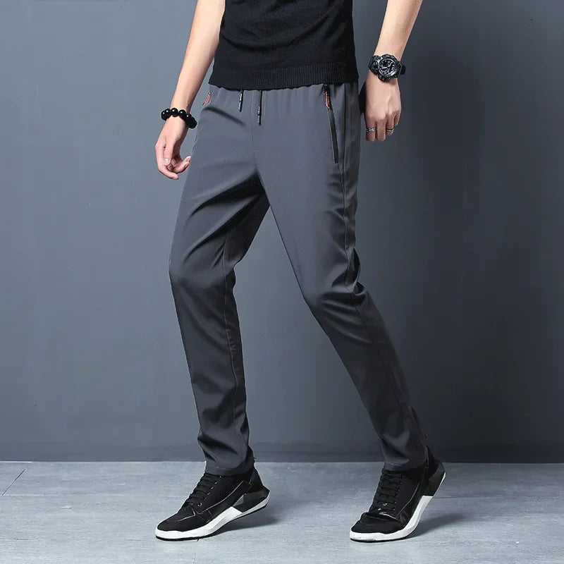 Calça casual masculina elástica, slim fit, cintura elástica, jogger, estilo coreano, clássica, azul, preta e cinza, tamanhos grandes
