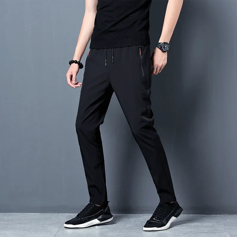 Calça casual masculina elástica, slim fit, cintura elástica, jogger, estilo coreano, clássica, azul, preta e cinza, tamanhos grandes